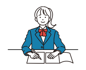 机に向かう女子学生